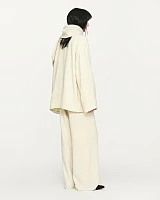 Ivory textured wool fringed straight pants