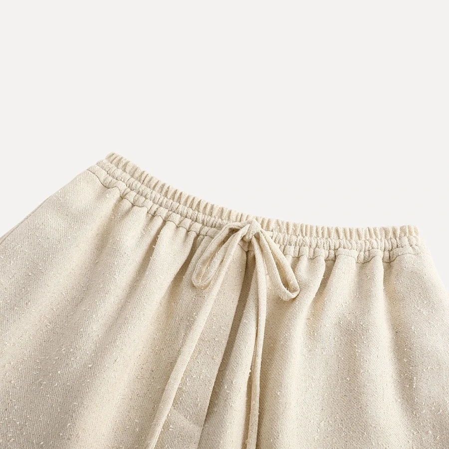 Ivory textured wool fringed straight pants